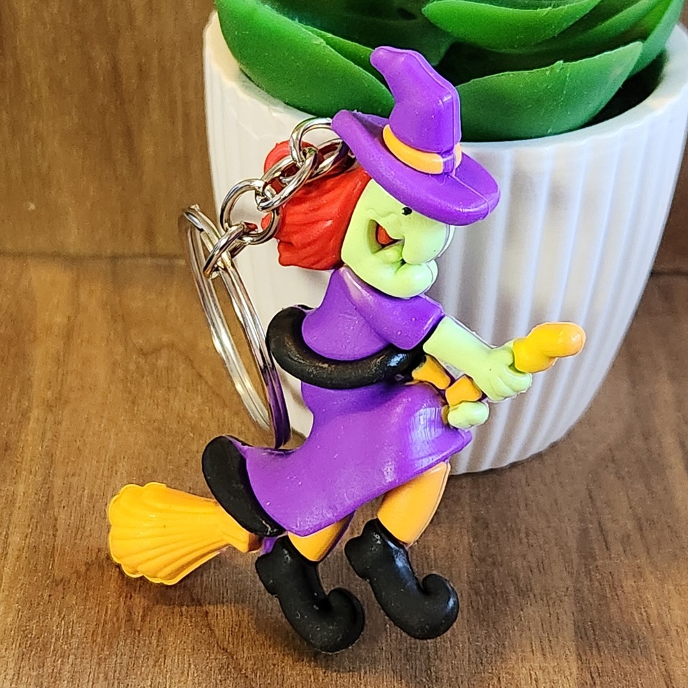 Vintage Style Halloween Witch on Broomstick Keychain Purple Green 2.75"
